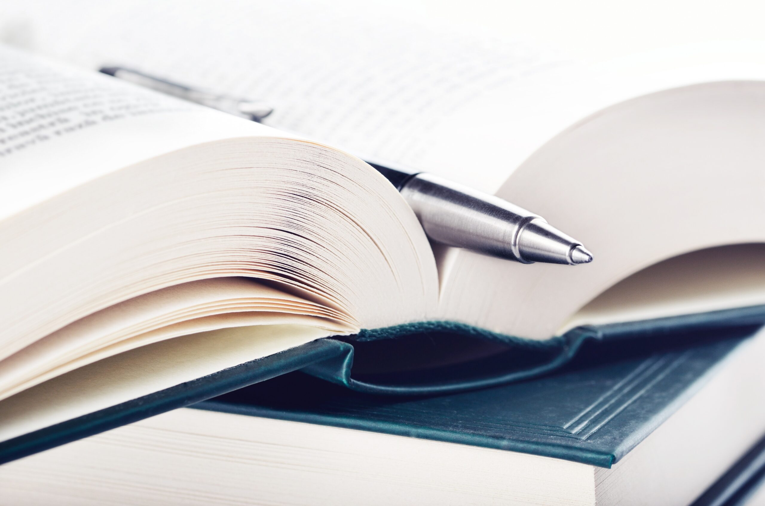 A pen resting on a book